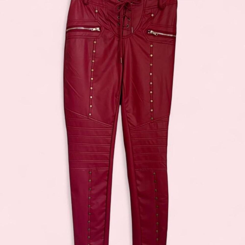 Red Faux Leather Pants with Zipper Details and Stud Accents.